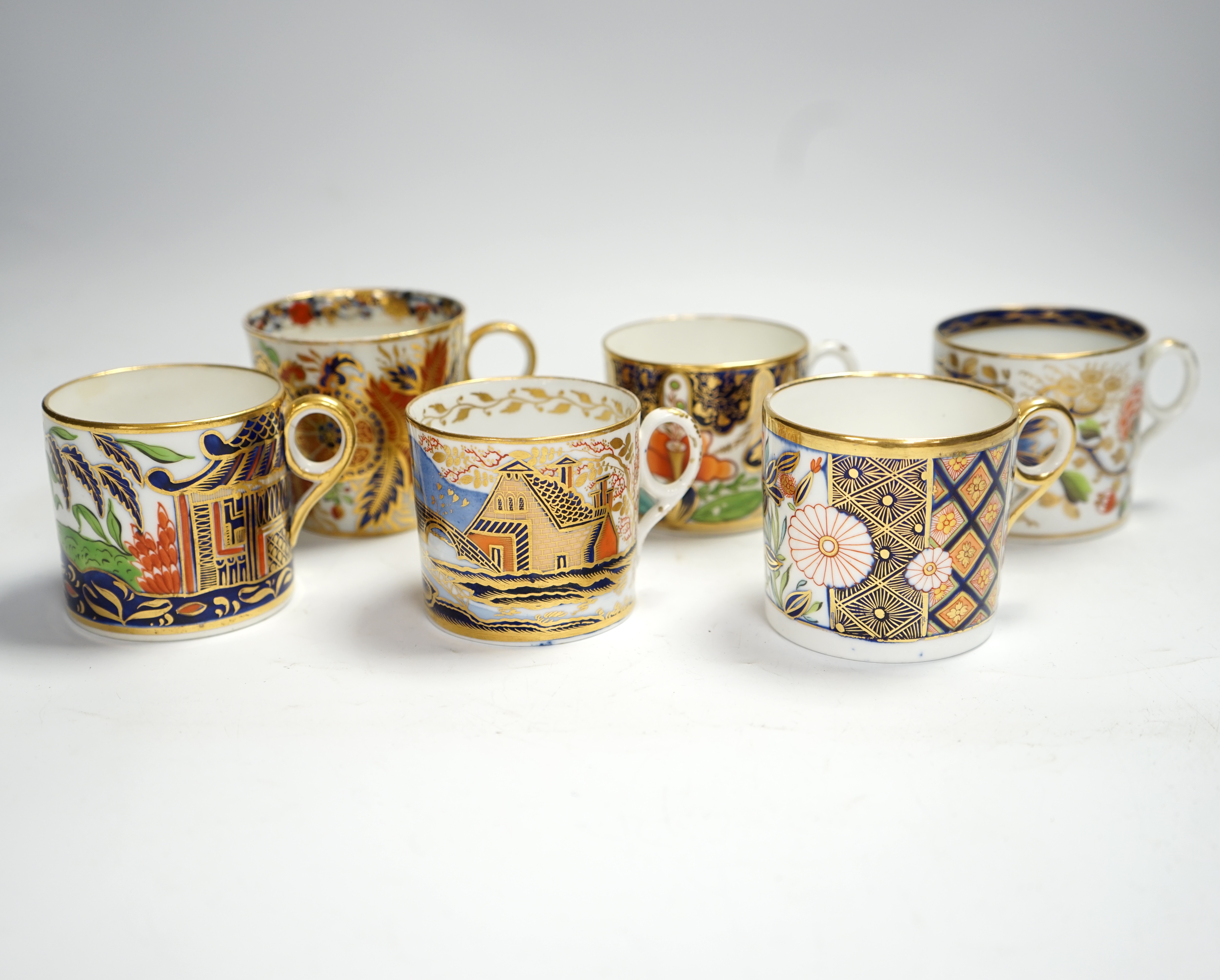 Twelve mixed 1800-1820 English porcelain Imari patterned coffee cans